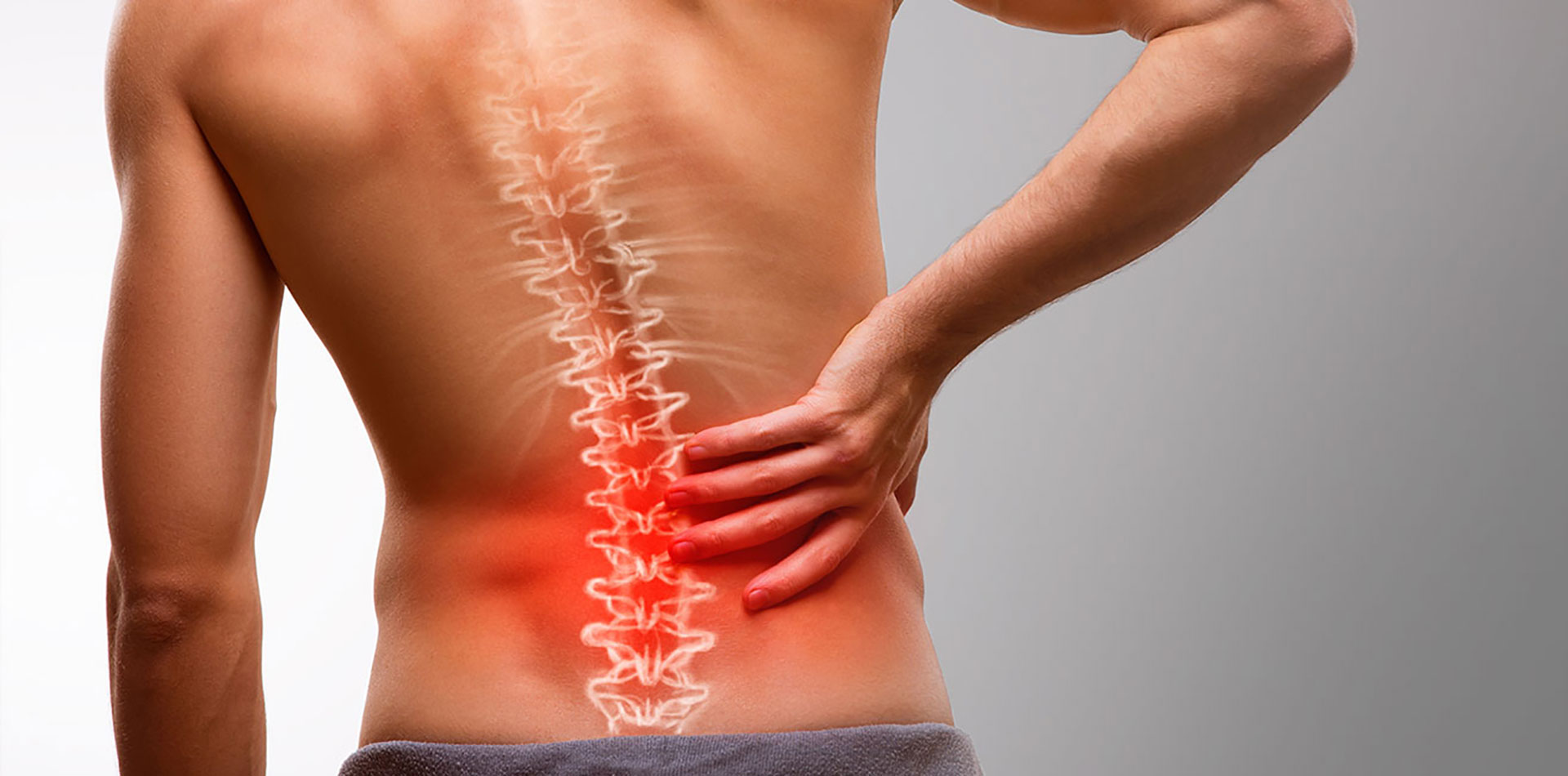 Man experiencing back pain from spinal injury